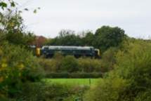 An English Electric Class 40 'Whistler' slips through a clearing between Arley and Highley
